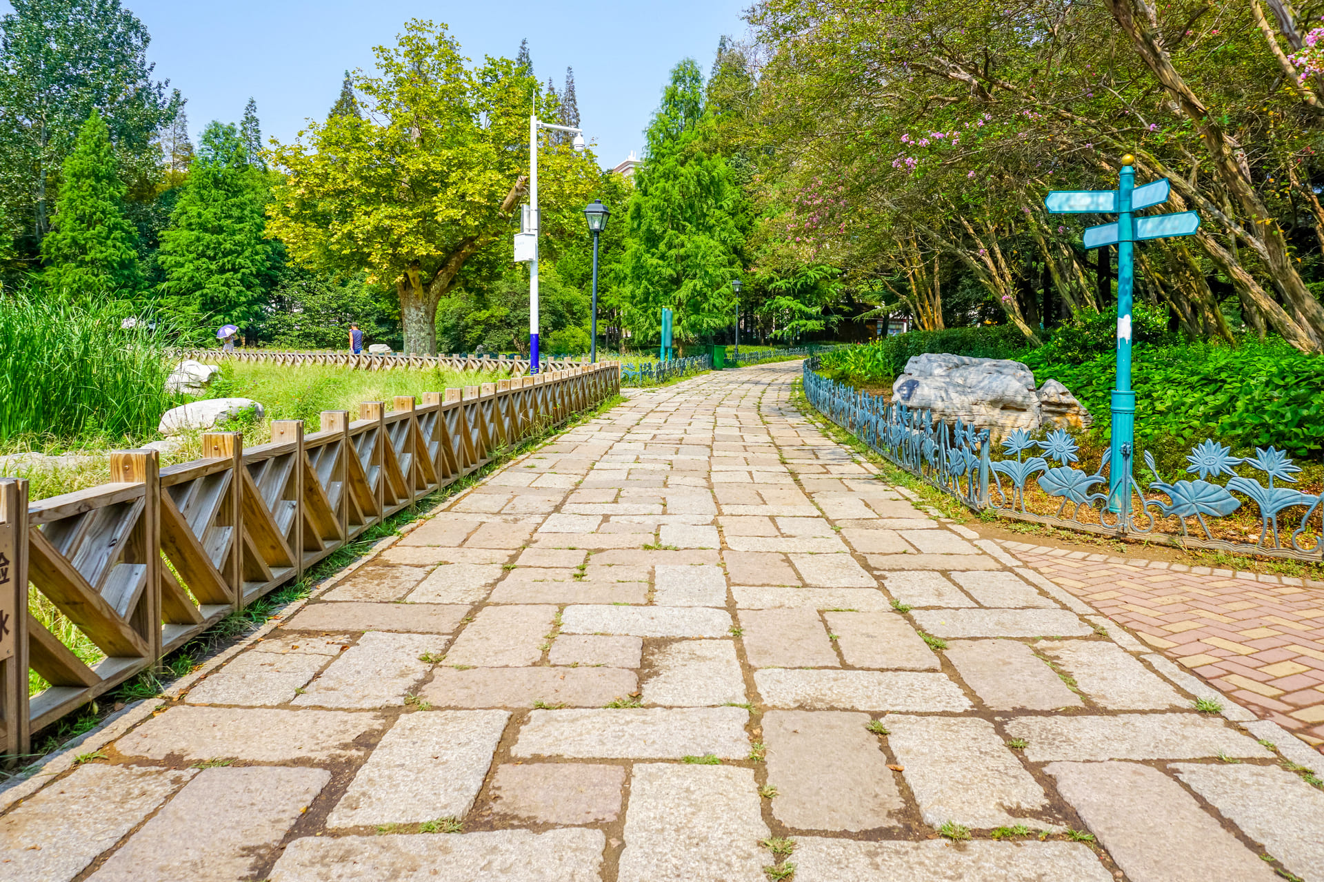 Beautiful stone walkway pavers creating a durable and scenic pathway in a lush green park.