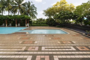 Travertine paver pool decks in Largo with tumbled stone finish