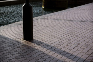 Modern paver driveway designs in Largo with charcoal linear layout