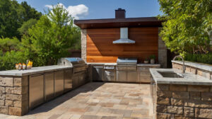 Outdoor kitchen paver installations in Largo with built-in grill and bar seating